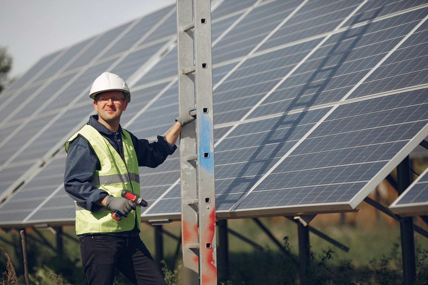man-with-white-helmet-near-solar-panel_1157-29971