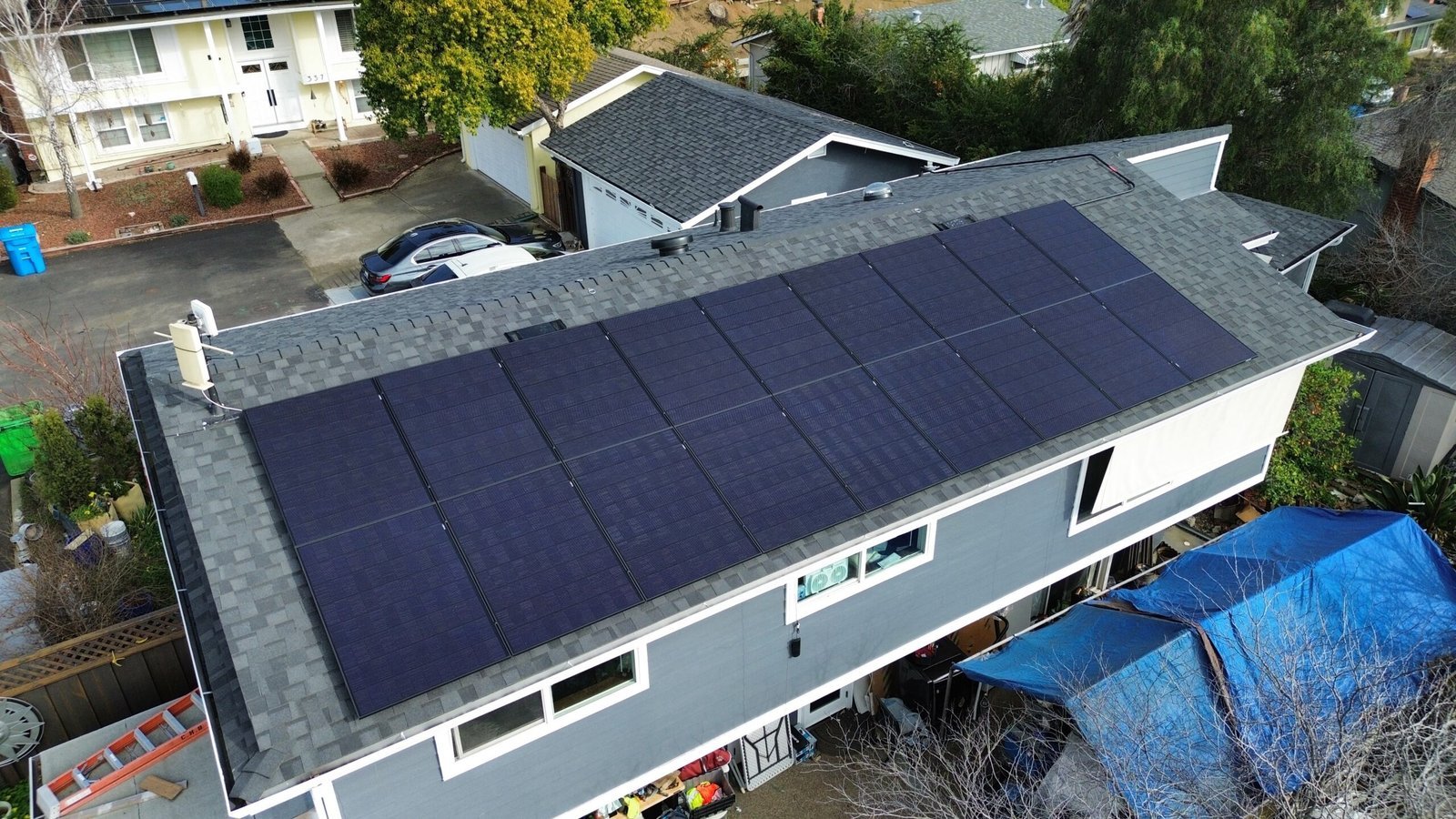Aerial view of a completed rooftop solar array on a two-story Bay Area home